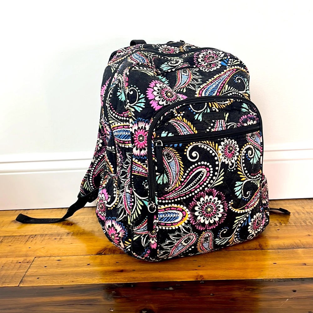 Black bandanna bag has 5 pocket, adjustable straps- no damage to bag.